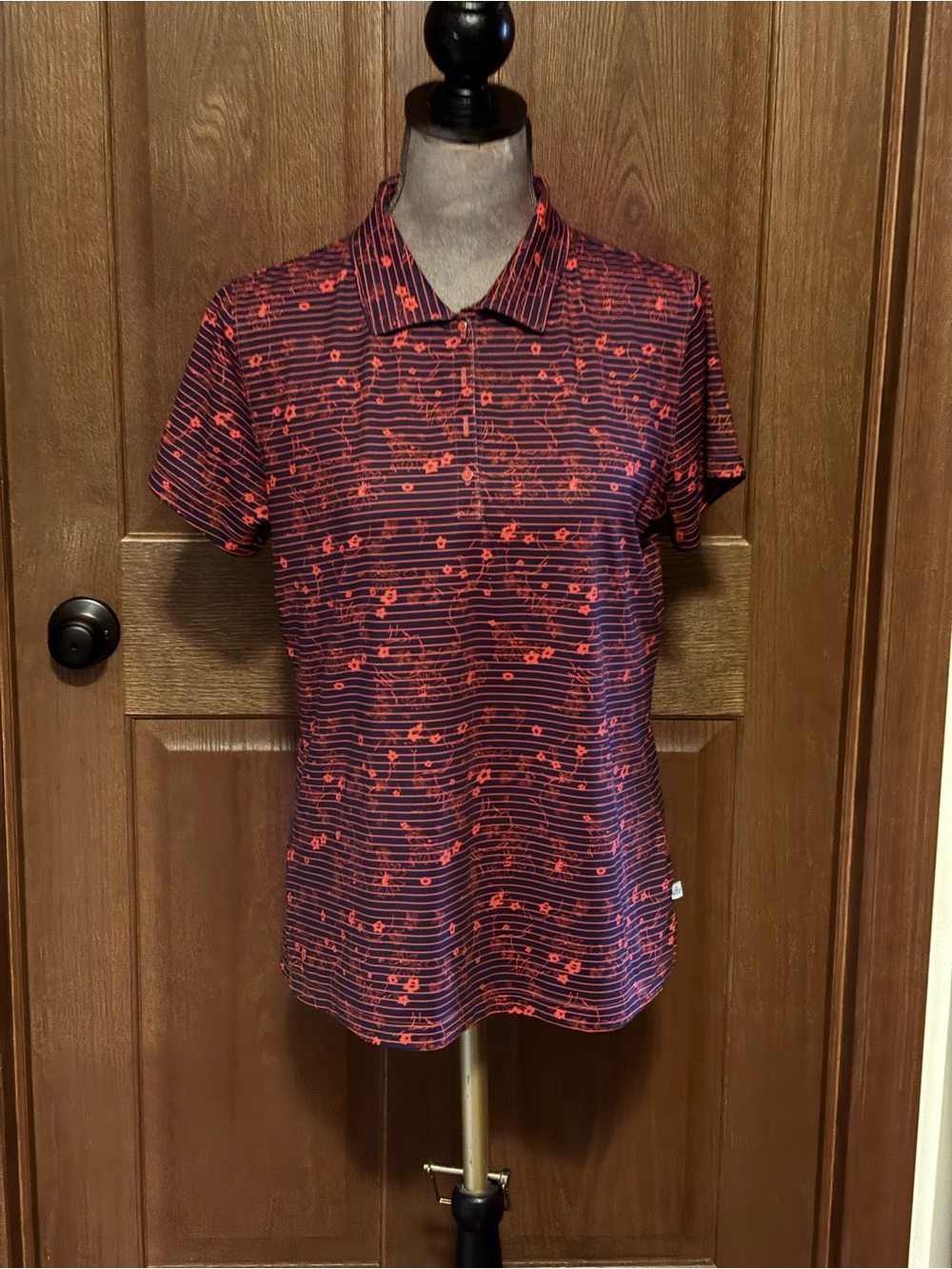 Lady Hagen Navy Polo with Coral Floral Stripe Pattern